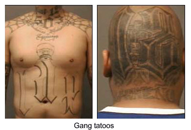 Gang tatoos on chest and back of head