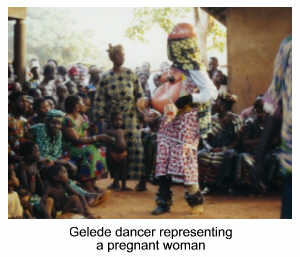 Gelede Society dancer representing a pregnant woman